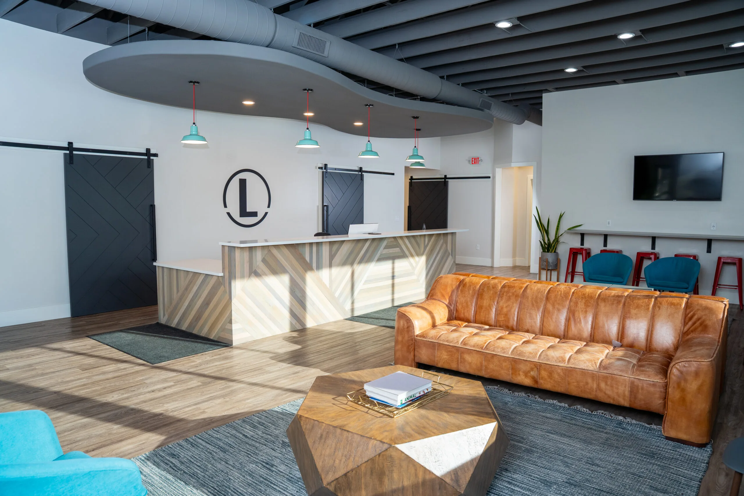 Modern waiting area with leather couch at Lovell Orthodontics in Morton & Washington